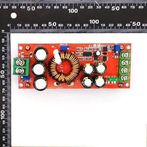 1200W 20A DC Converter Boost Step-up Power Supply Module In 8-60V Out 12-83V - shown from above on a measuring mat, featuring a red circuit board, copper coil, and terminals.
