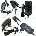 12V 1.5A Power Supply Adapter AC DC Switching Regulated Supply Refurnished - multiple black power adapters with two-pin plugs and barrel connectors.