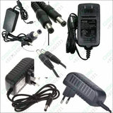 12V 1.5A Power Supply Adapter AC DC Switching Regulated Supply Refurnished - multiple black power adapters with two-pin plugs and barrel connectors.
