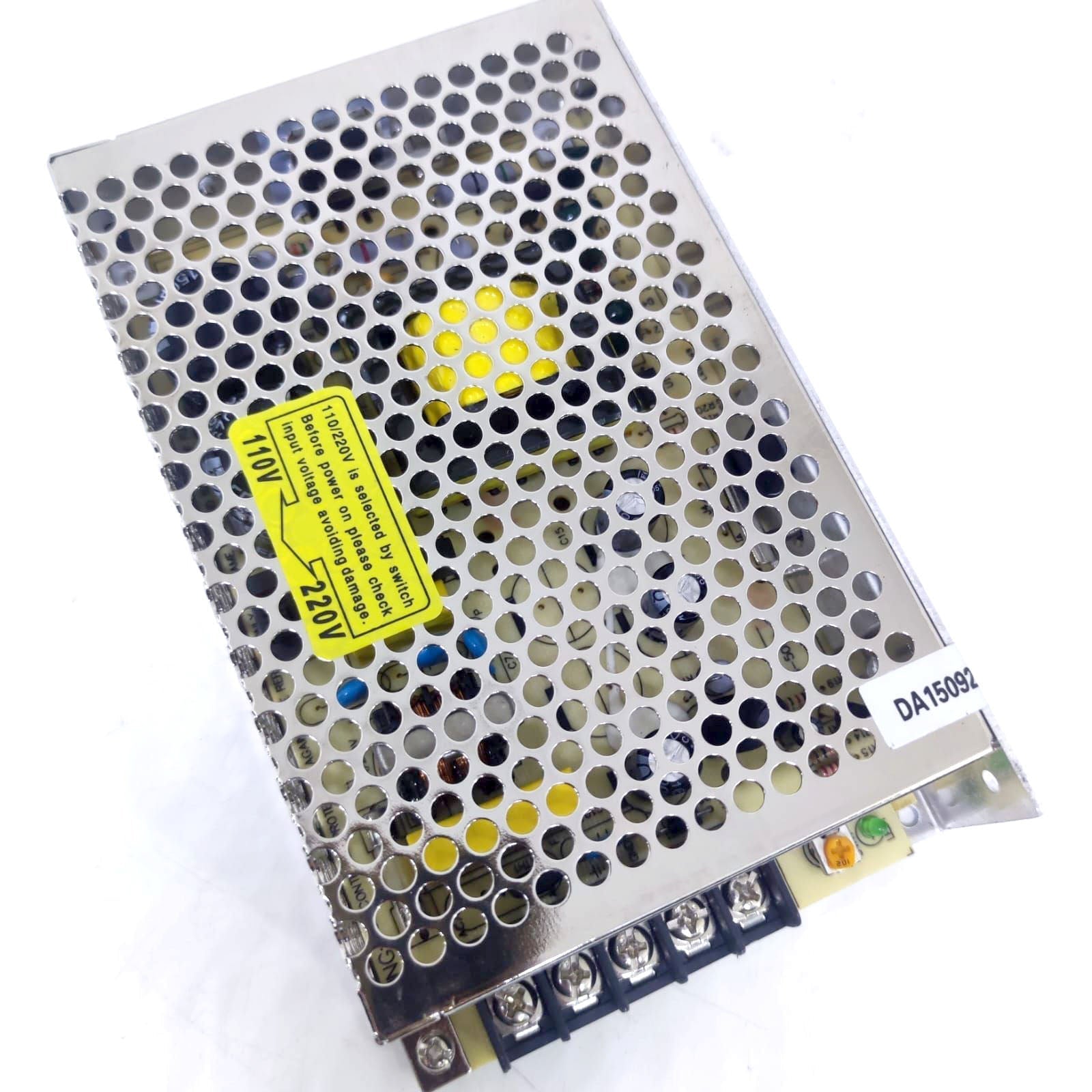 12V 10A Max Well Power Supply - in a rectangular metal case with a perforated cover, a yellow voltage selection warning label, and a screw terminal block.