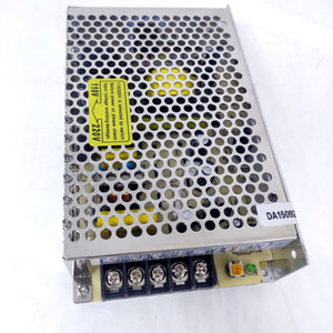 12V 10A Max Well Power Supply - a metallic rectangular unit with a perforated top, a voltage selector warning label, and five screw terminals at the base.