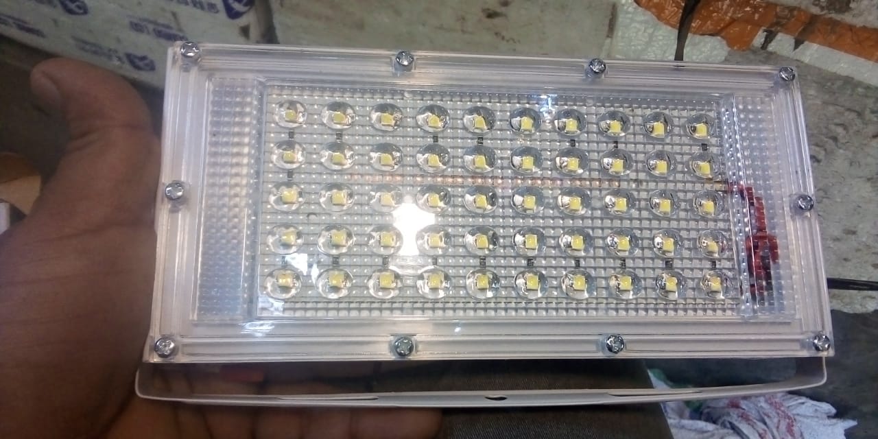 12V 12W LED Light Flood Light Low Quality - a rectangular white-framed LED light with a transparent cover showing an array of small, circular LED bulbs.