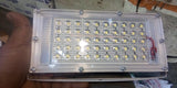 12V 12W LED Light Flood Light Low Quality - a rectangular white-framed LED light with a transparent cover showing an array of small, circular LED bulbs.