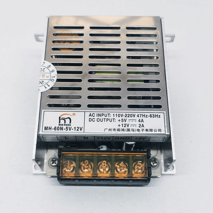 12V 2A And 5V 4A Dual Output DC Power Supply - a metal-cased unit with a terminal block featuring five screw-down connections and a spec label.