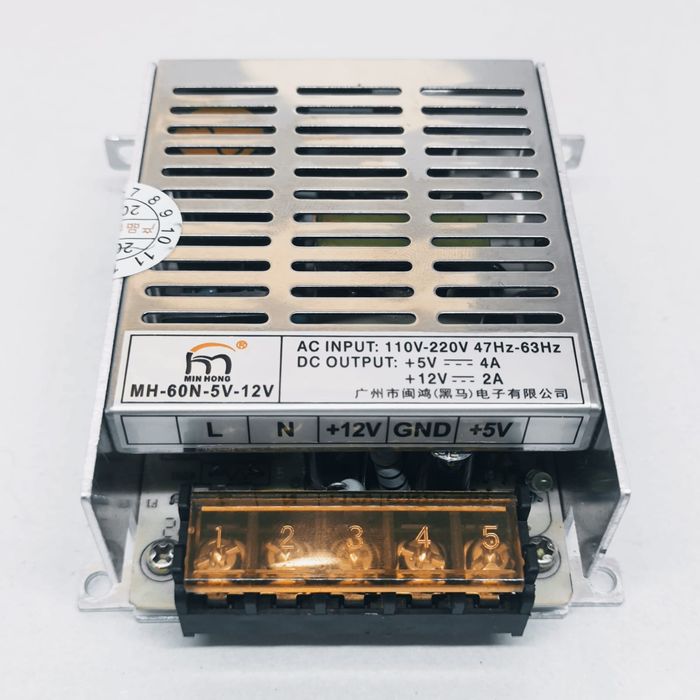 12V 2A And 5V 4A Dual Output DC Power Supply - a silver metal unit with a vented top, a label showing specs, and a five-terminal screw connector block.