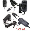 12V 2A Power Supply Adapter AC DC Switching Regulated Supply Refurnished - several black AC/DC switching power adapters with various plug types and DC barrel connectors arranged in a collage.