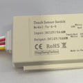 12V 60W (5A) Mirror Touch Sensor - shown as a rectangular beige device with a label detailing specifications and four colored wires extending from one side.