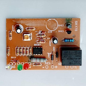 12V Battery Protection Auto Cut Off Circuit BMS - a rectangular brown circuit board with an LM358 chip, a relay, three LEDs, and a 10k potentiometer.