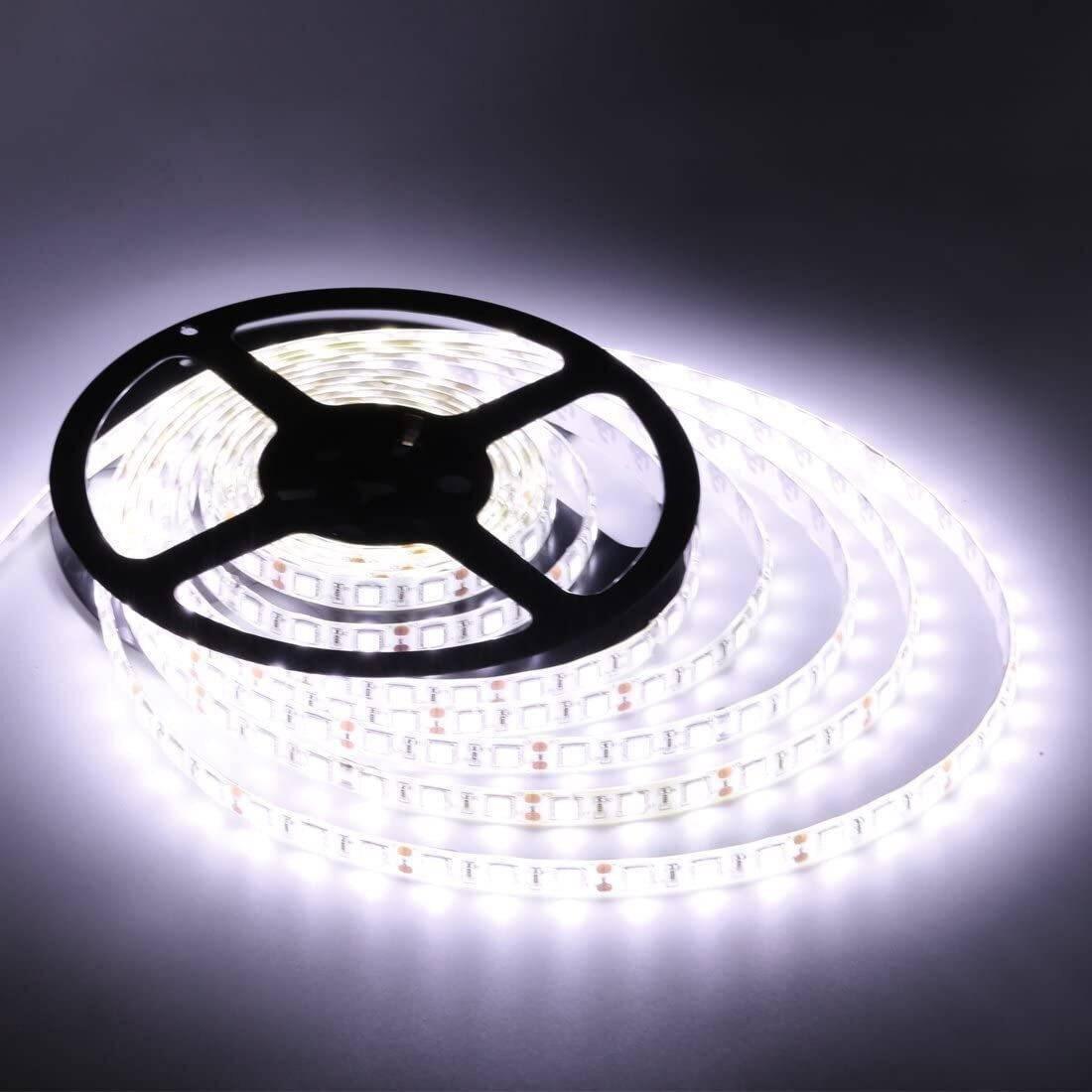 12V DC 5 Meter White LED Strip - shown coiled on a black plastic spool, illuminated with a bright white light against a dark background.