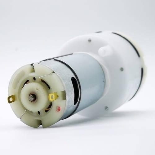 12V DC Gas Pump Air Pump For LCD Touch Separator And Multiple - a cylindrical silver motor attached to a white plastic pump housing with two gold-coloured electrical terminals.