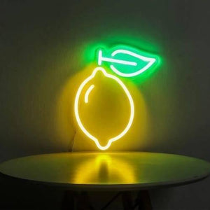 12V Lemon Yellow Neon Flexible Strip Light 1m Waterproof SMD 5050 Rope String Silicone Lamp Outdoor Lighting - with a green leaf, mounted on a wall above a round table.