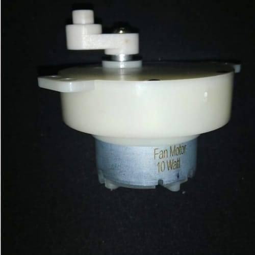 12V Low RPM Incubator Egg Turner Motor DC Gear Motor DC Moving Motor - a white plastic gear housing attached to a metal DC motor labeled "Fan Motor 10 Watt" on a black background.