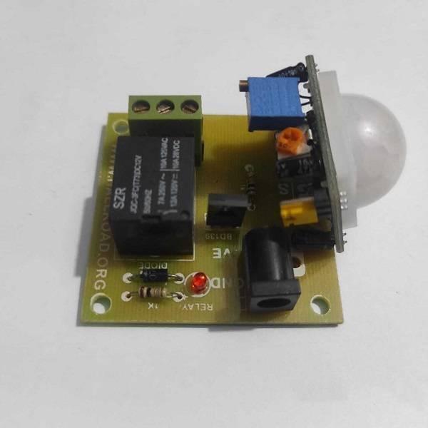 12V PIR Motion Sensor Switch Module - a green circuit board with a white dome sensor, a black relay, a power jack, and a red indicator LED.