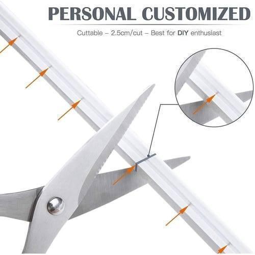 12V Red Neon Flexible Strip Light 1m Waterproof SMD 5050 Rope String Silicone Lamp Outdoor Lighting - close-up showing a pair of scissors cutting the white silicone strip at a marked 2.5cm interval.