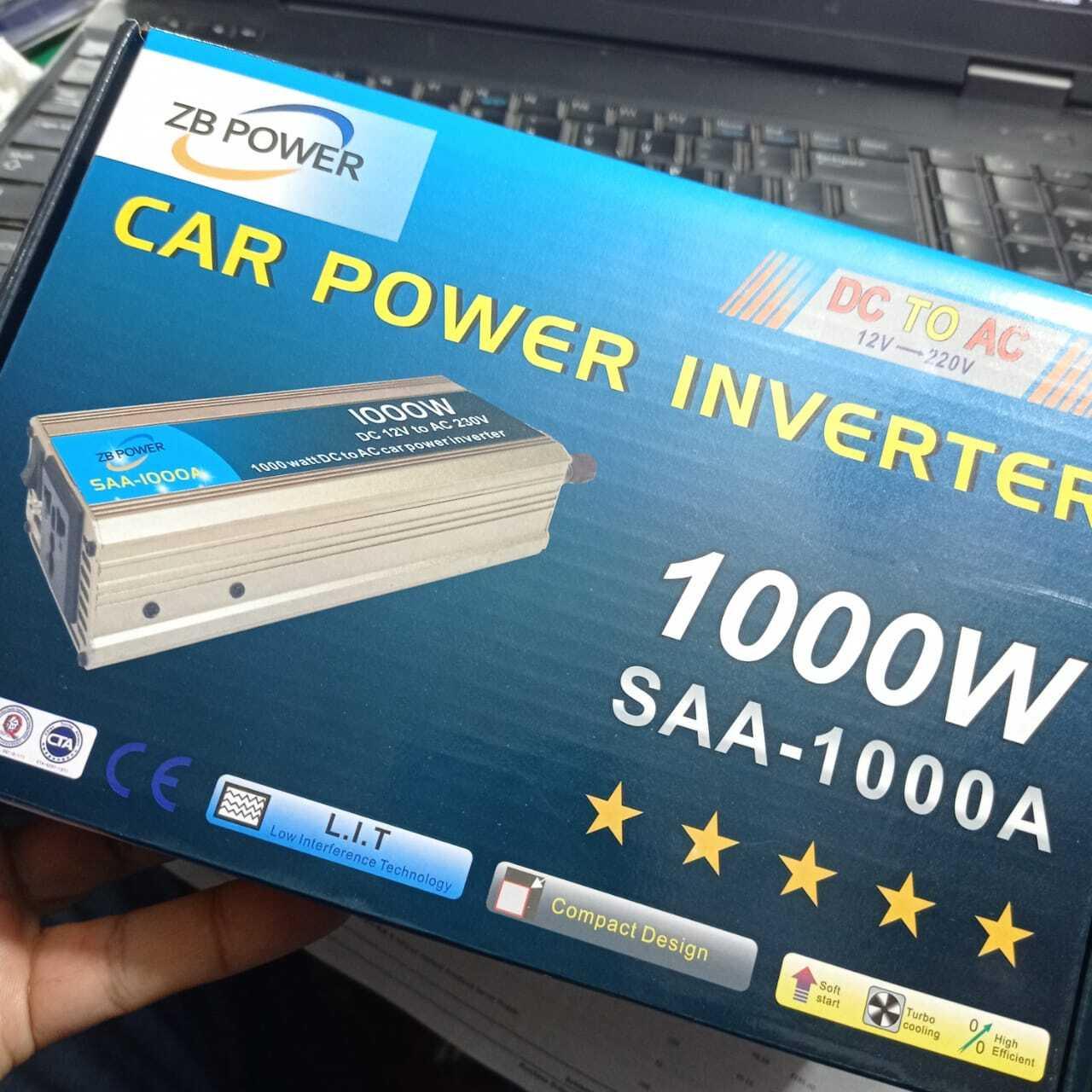 12V To 220V 1000W Power Inverter Car Power Inverter - shown in its blue and white retail packaging box featuring a picture of the silver inverter unit.