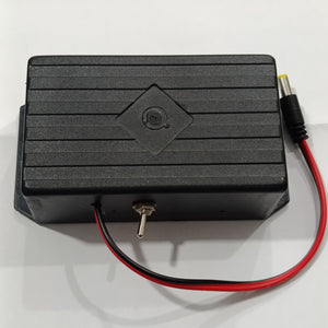 12V WiFi Router Power Bank Without Adapter - a black rectangular plastic enclosure featuring a central toggle switch and a red and black DC power cable.