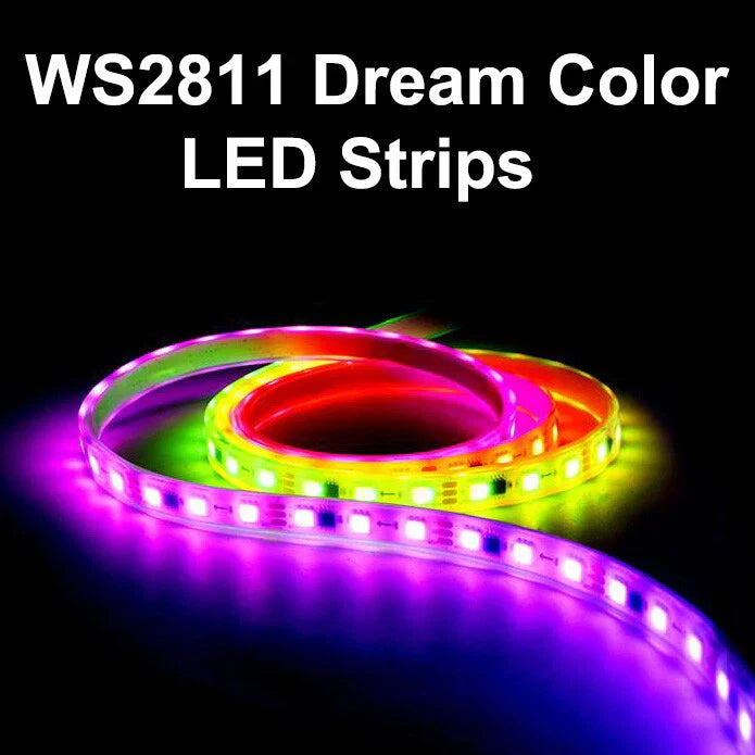 12V WS2811 LED Strip Lights, RGB LED Pixel Strip 5m 300 LEDS IP30 Addressable Intelligent LED Light Strip For Advertising Decoration DIY Projects With Remote And 5V 2A Power Supply - WS2811 Dream Color LED Strips shown as a coiled, glowing flexible light strip displaying multiple vibrant colours against a black background.