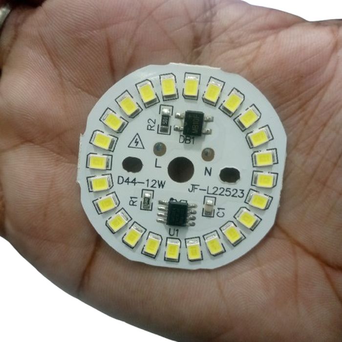 12W 220V LED Light - shown as a circular white PCB held in a hand, featuring multiple surface-mounted LEDs, a bridge rectifier, and an IC chip.
