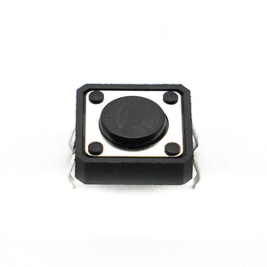 12x12x4mm Tactile Push Button - a square black electronic switch with a central circular button and four metal pins extending from the base.
