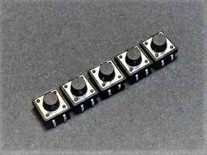 12x12x7.5mm Tactile Push Button Switch - a row of five square black tactile push button switches with metal tops on a dark grey surface.