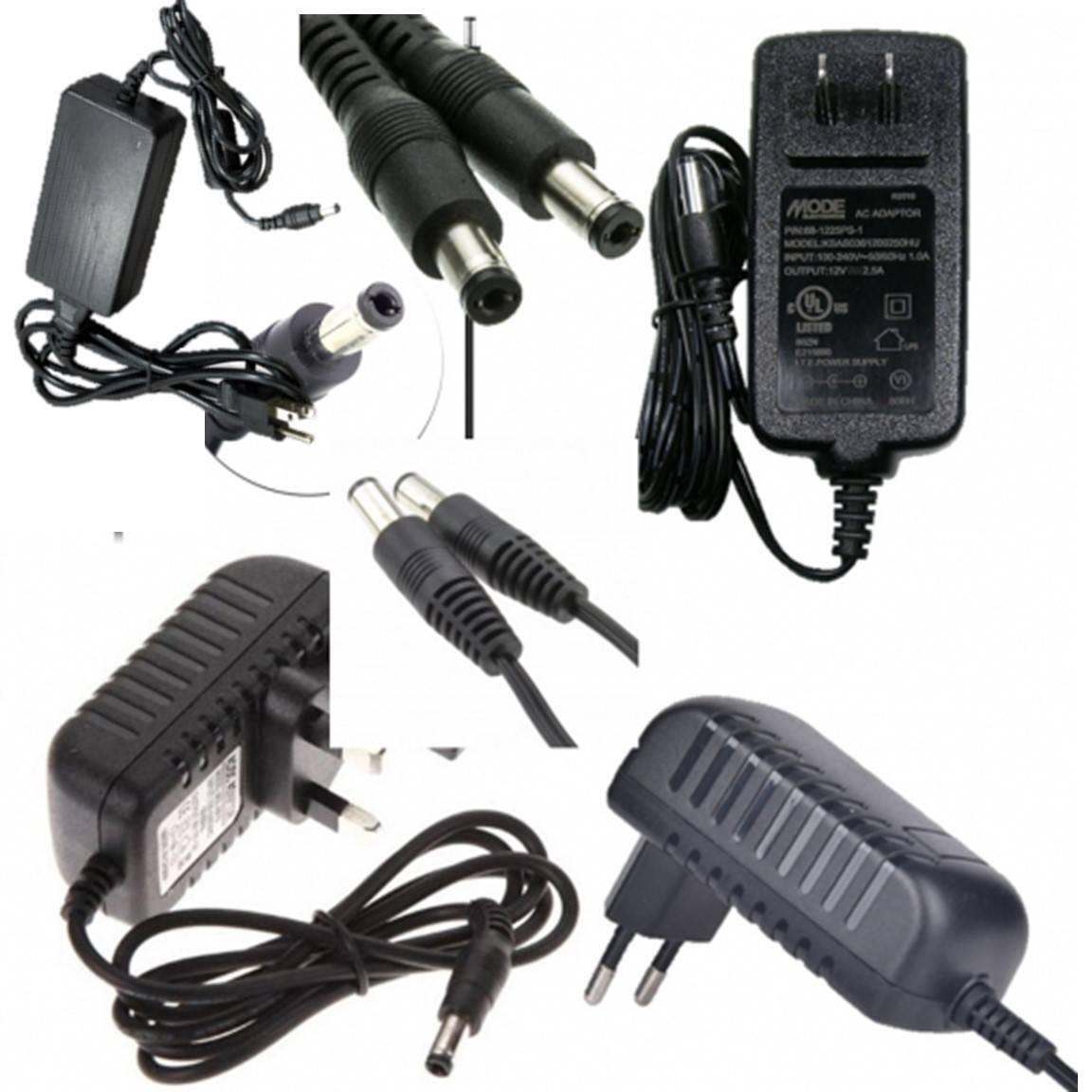 14 to 15V 2A Switching Adapter Power Supply 2.1mm 2.5mm 5.5mm Used - multiple black AC power adapters with DC barrel connectors and various plug types.