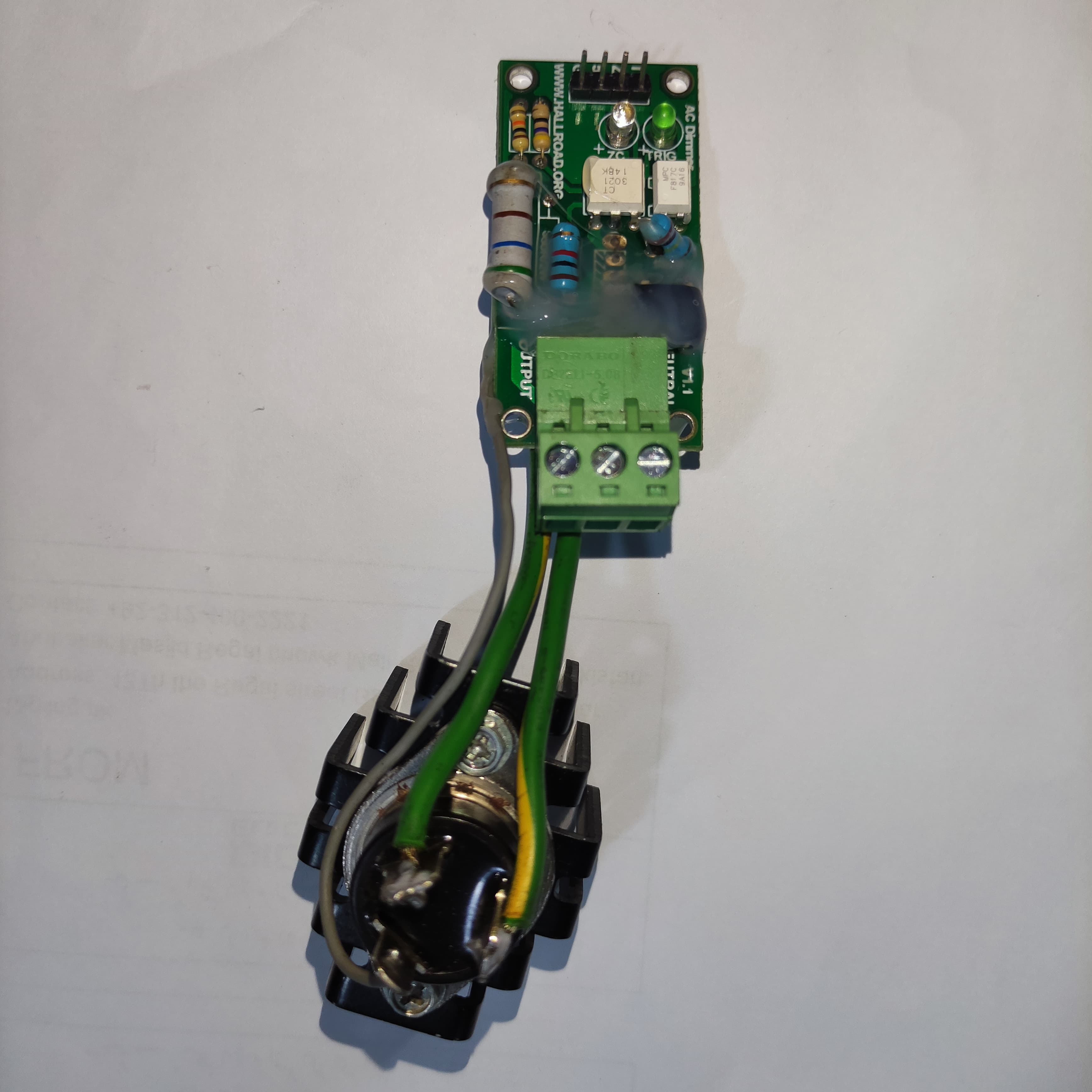 15amp 220V AC Arduino 1 Channel TRIAC Module With Zero Crossing Sensor - the green circuit board connected to a black TRIAC component by wires.