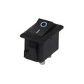 15MMX10MMX8MM KCD11 Rocker Switch 3A - a small black rectangular rocker switch with a white power symbol on the top surface and two metal pins at the base.