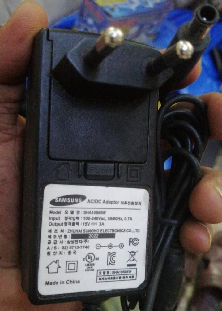 15V 3A Power Supply Charger Adapter 15V 3000mA - black rectangular unit with a two-pin AC plug, a DC output cable, and a label showing technical specifications.