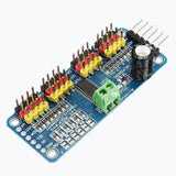 16 Channel Servo Motor Driver PCA9685 12 Bit PWM I2c Module For Arduino - a blue rectangular circuit board with header pins, a green terminal block, and a capacitor.