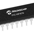 16F876 IC - PIC16F876 IC is a black, rectangular 28-pin integrated circuit chip with metallic pins extending from the sides, viewed from an elevated angle.