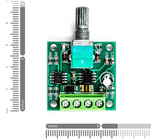 1803BK 30W DC Motor PWM Speed Controller – Precise Motor Control | Digilog.pk - a green circuit board with a silver potentiometer knob, a four-terminal screw connector, and ruler scales.