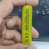 18650 1600mAh 3.7V Li-ion Rechargeable Cell For DIY Projects - a close-up view of a lime green cylindrical battery with printed technical specifications and a barcode.