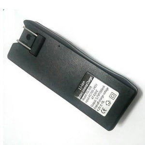 18650 Battery Charger Tg-008 - a black rectangular wall-plug charger with a fold-out AC plug and a label detailing specifications on its back.