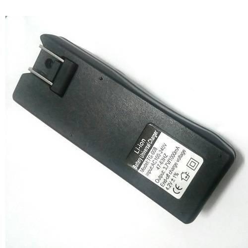 18650 Battery Charger Tg-008 - a black rectangular wall-plug charger with a fold-out AC plug and a label detailing specifications on its back.