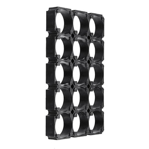 18650 Battery Holder 3x5 Cell 18650 Batteries Spacer Holders Radiating Plastic Holder Bracket For DIY Battery Pack - a black plastic grid bracket with fifteen circular slots arranged in three columns and five rows for mounting batteries.