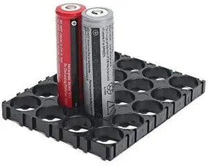 18650 Battery Holder 4x5 Cell 18650 Batteries Spacer Holders Radiating Plastic Holder Bracket For DIY Battery Pack - a black plastic grid spacer with two cylindrical 18650 batteries, one red and one grey, standing upright inside it.
