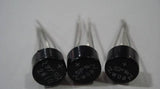 1A Bridge Rectifier 2W10 - three round, black electronic components with four metal pins each and printed model markings.