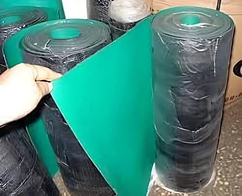 1m*1m*2mm Antistatic ESD Floor Mat/ESD Rubber Table Mat For Production/S5 PVC Antistatic Workbench Rubber Mat - a hand unrolling a section of the green and black rubber mat from a large, plastic-wrapped roll.