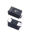 1N4007 SMD M7 Diode - a close-up showing two black rectangular electronic components with silver metal terminals, one marked with the text M7.