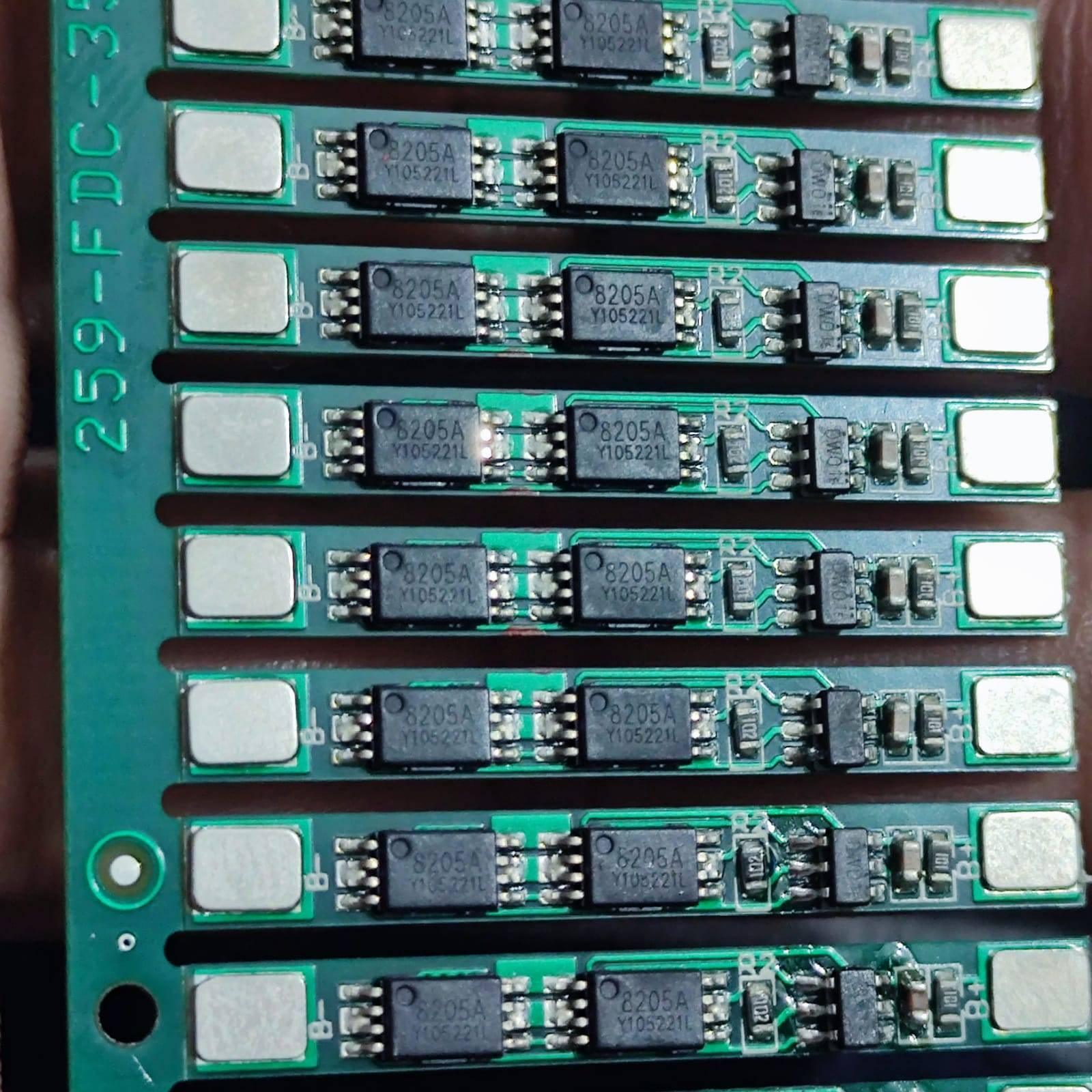 1s 4A BMS Module For Li Ion Batterey 259-fdc-3540 - a green panel with eight identical battery management circuit strips featuring 8205A chips.