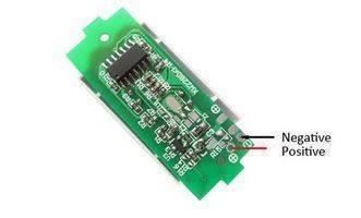 1s Lithium Battery Capacity Indicator - a small green rectangular circuit board with a chip, surface-mount components, and labeled power pads.