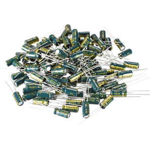 1uF 50V Electrolytic Capacitor Radial - a large pile of small, cylindrical green electrolytic capacitors with metal leads.