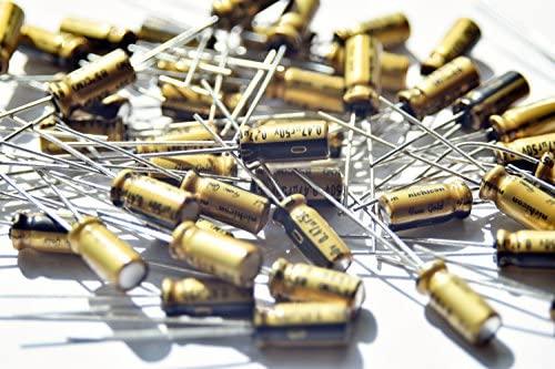 1uF 50V Electrolytic Capacitor Radial - pile of gold-coloured cylindrical electronic capacitors with two wire leads extending from one end.