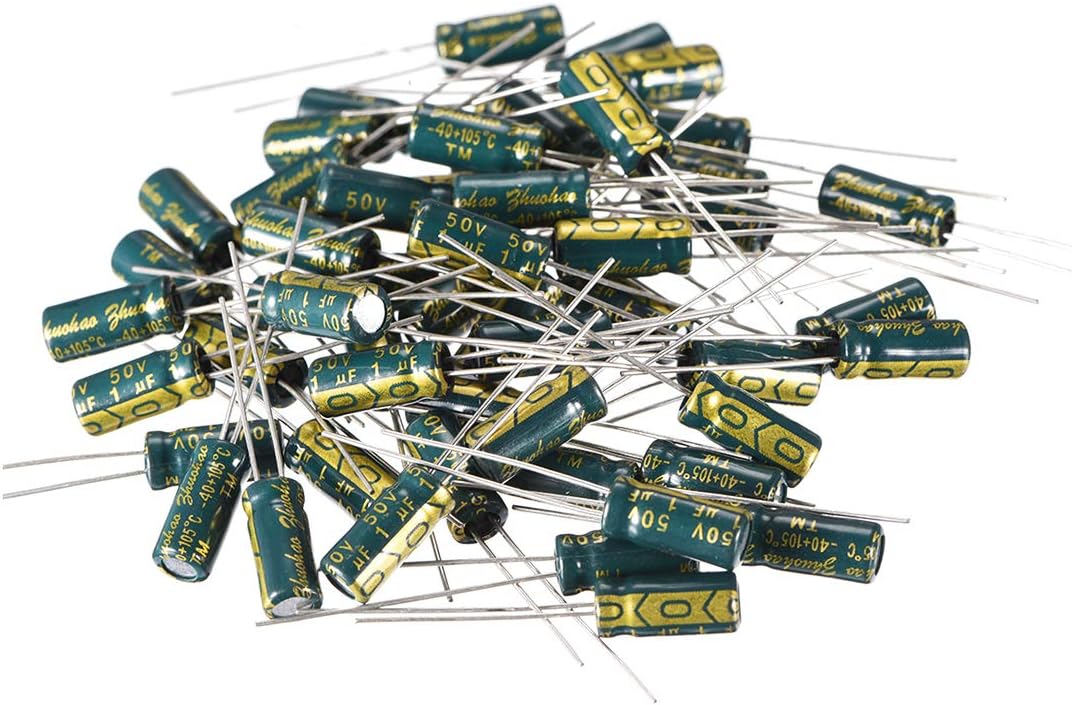 1uF 50V Electrolytic Radial Capacitor - a large pile of green cylindrical capacitors with two metal wire leads extending from each base.