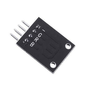 1watt RGB LED Module Ky 009 - a black rectangular circuit board with four metal pins and labels for B, R, G, and a minus sign.