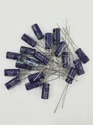 2.2uF 50V Electrolytic Capacitor - a pile of small, purple cylindrical capacitors with two metal leads each, scattered on a white background.