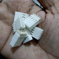 2.54mm 4-pin Male Female Connector - a handful of white plastic 4-pin male and female electrical connectors held in a palm.