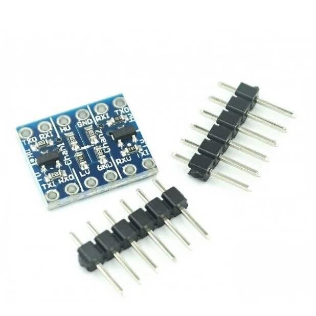 2 Channel Bi Directional Logic Level Converter - shown as a blue circuit board with labels and two sets of black pin headers on a white background.
