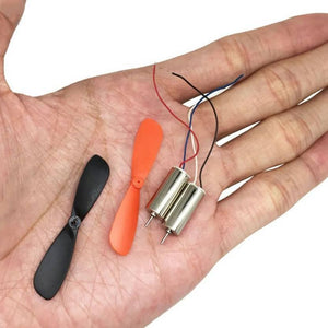 2 Pieces 1 Pair Helicopter Coreless Micro DC Motor with Propeller - two silver cylindrical motors with wires and one black and one orange propeller.