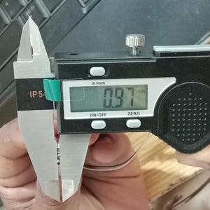 2 Pieces 1 Pair Helicopter Coreless Micro DC Motor with Propeller - being measured by a digital caliper showing a reading of 0.97 mm.